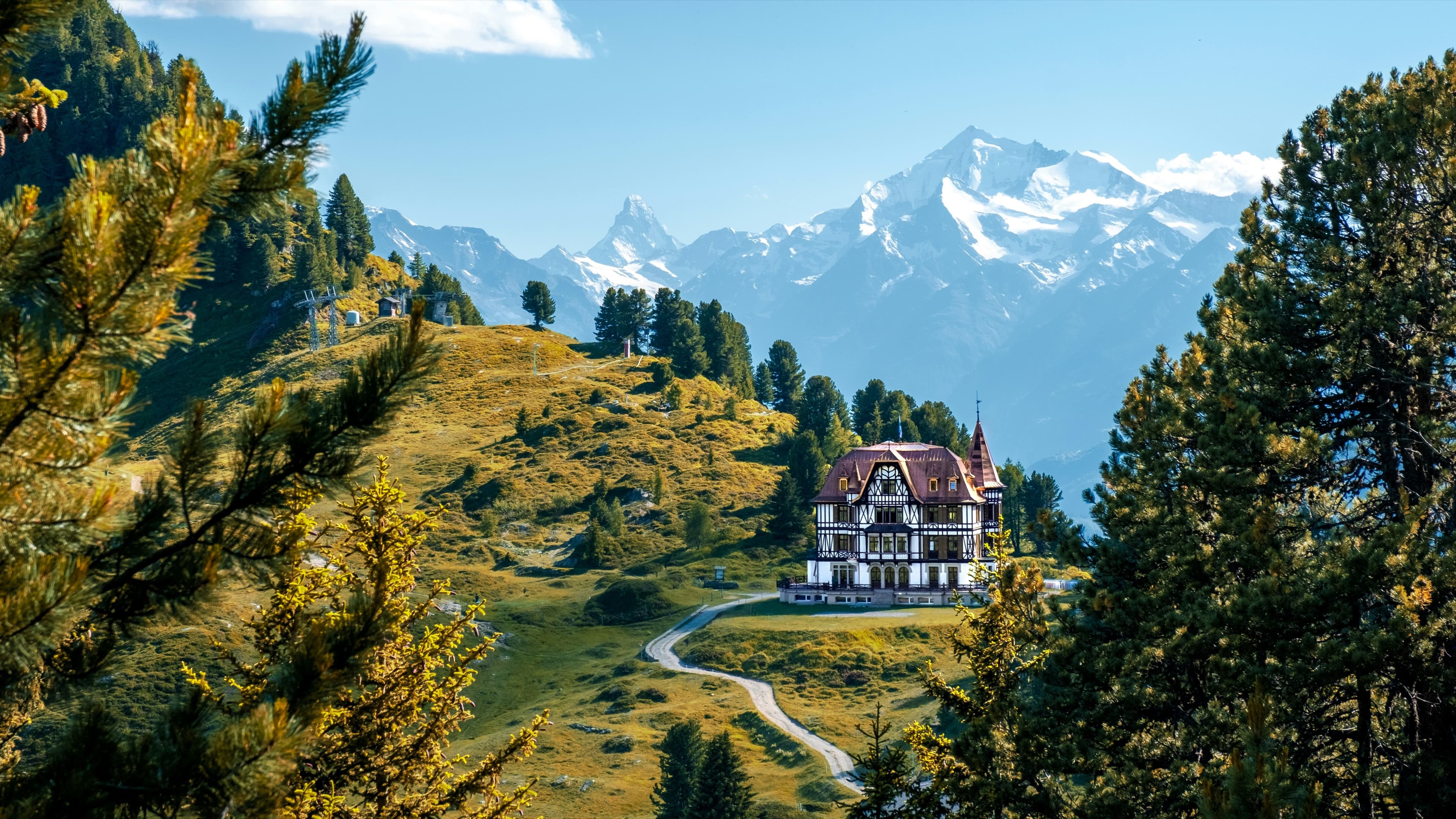 Villa Cassel on an alpine meadow at Riederalp, with the Matterhorn behind